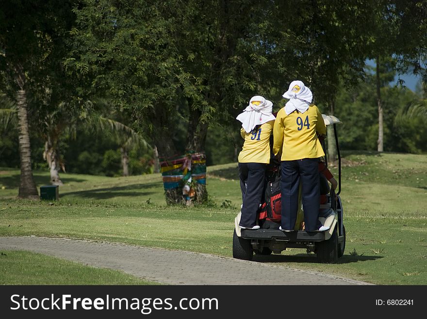 Two Caddies On A Golf Cart