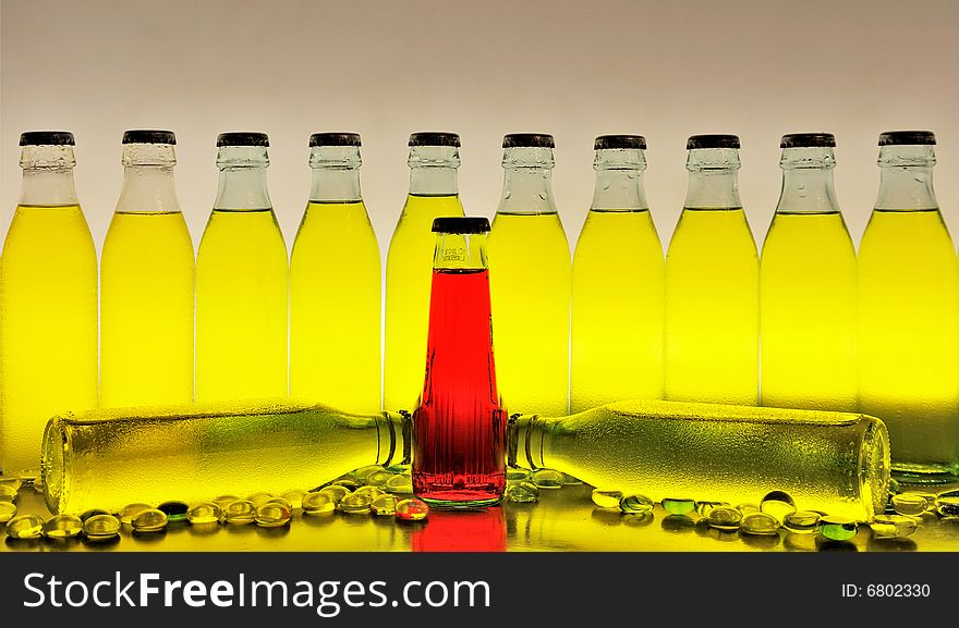 Row of yellow and red drinks against white background. Row of yellow and red drinks against white background