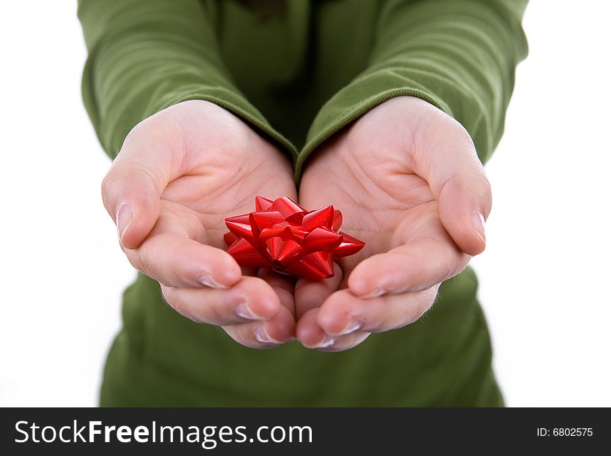 Santa woman holding small red ribbon in her hands isolated on white background