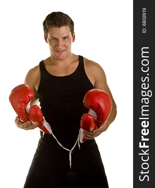 Boxer Holding Gloves And Looking At Camera
