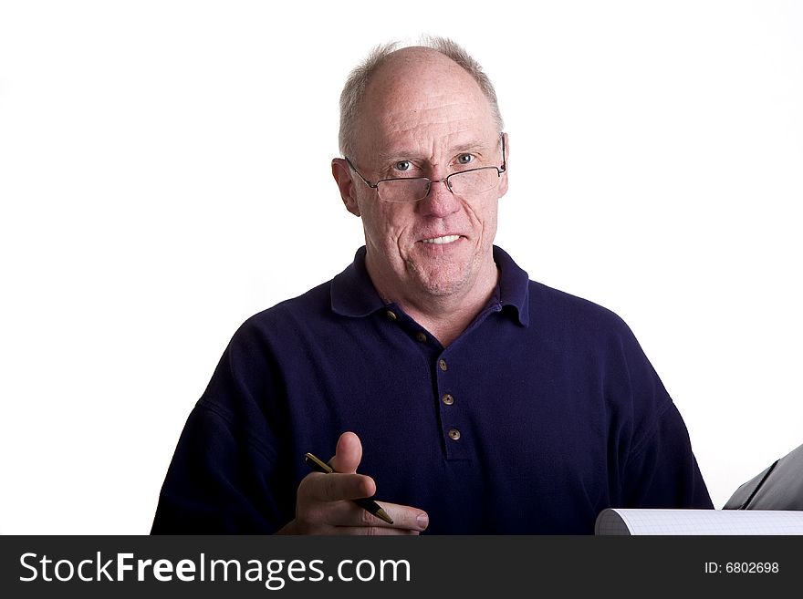 An older man presenting a deal or proposal in a notebook. An older man presenting a deal or proposal in a notebook