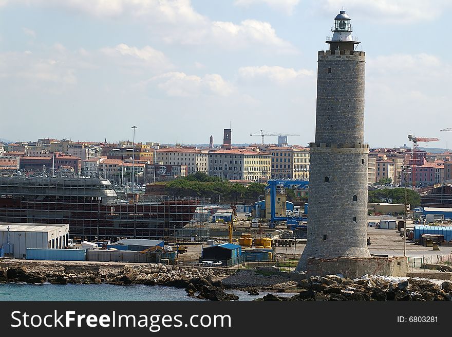 Closer view of Livorno port with a lighthouse and ship bulding. Closer view of Livorno port with a lighthouse and ship bulding