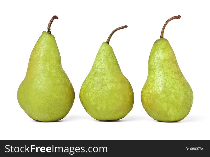 Row of three green pears. Isolated