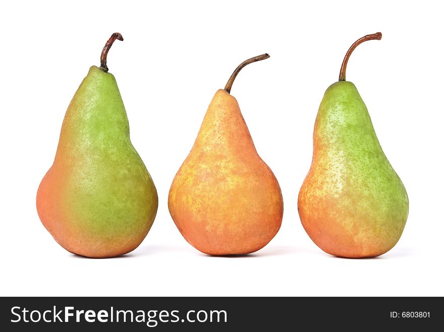 Row of three pears. Isolated