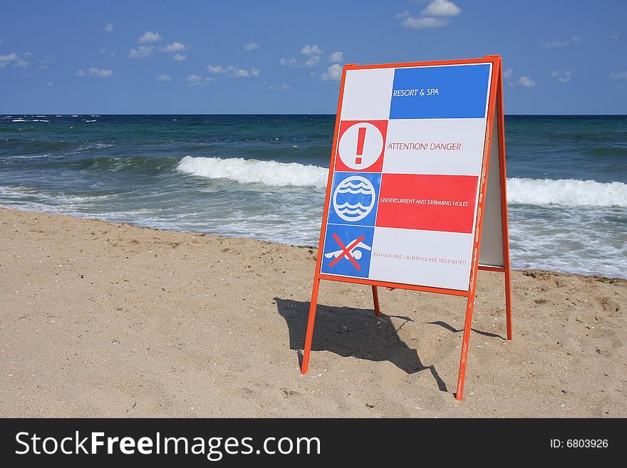 Sign Attention! Danger on the beach. Sign Attention! Danger on the beach.