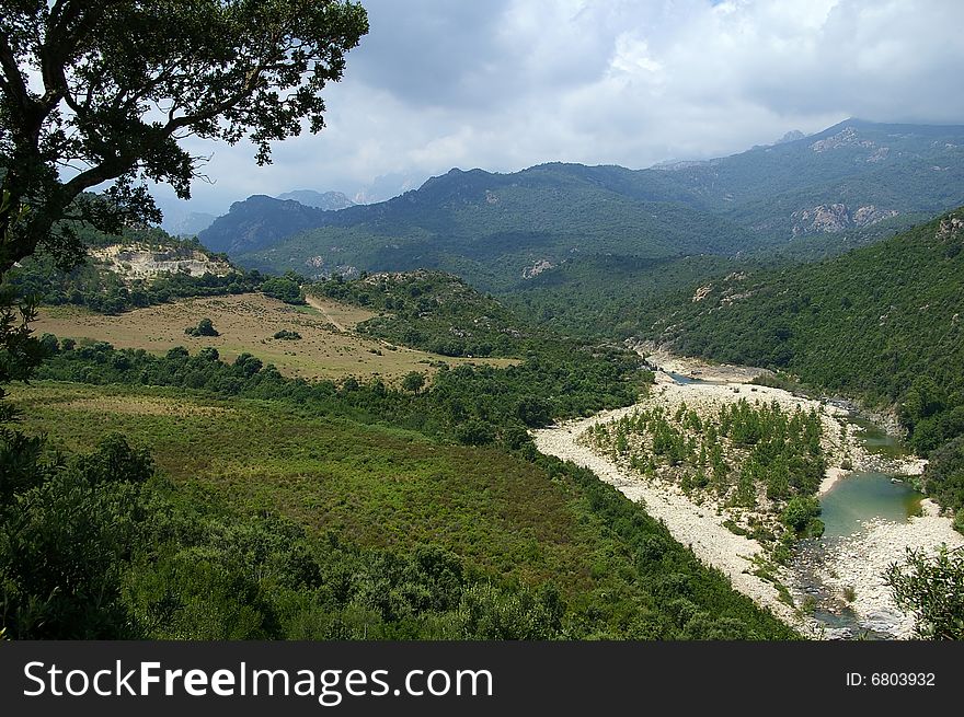 Beautiful landscape with mountains and a heart figured creek in Corsica. Beautiful landscape with mountains and a heart figured creek in Corsica.