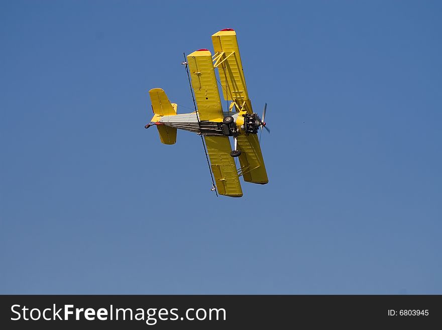 Yellow airplane in the sky