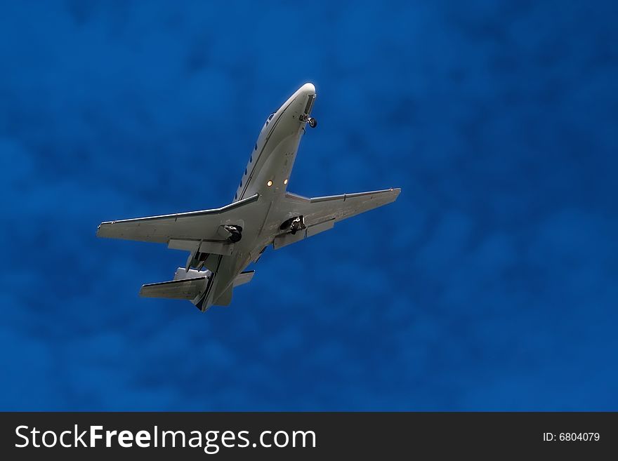 Airplane in the blue sky