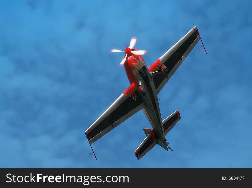 Red airplane in the sky