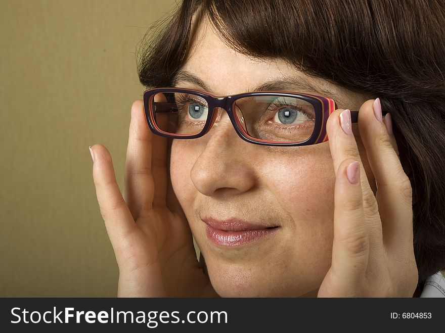 A woman looking through glasses. A woman looking through glasses