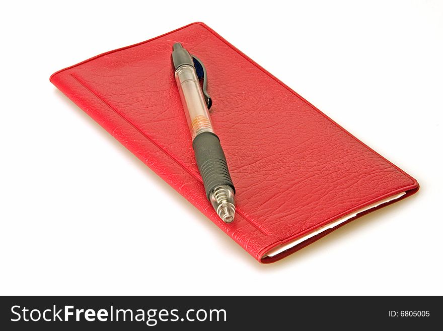 Red check book and pen on white background
