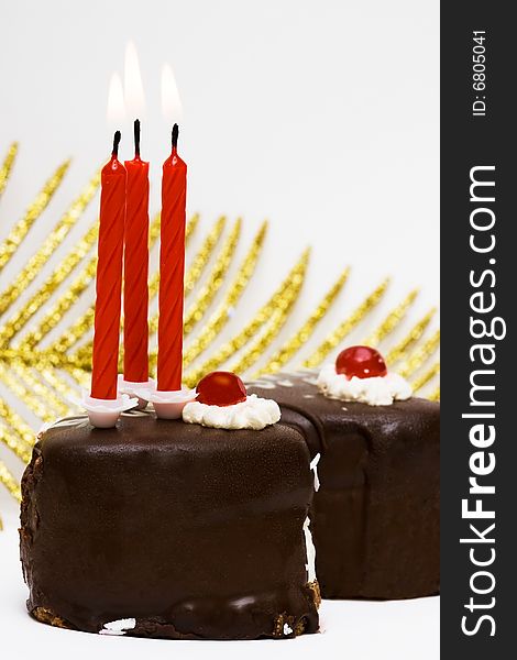 Cake with candles and leaf