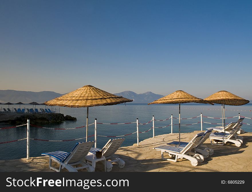 Sunshades in Turkish resort in the Aegean sea