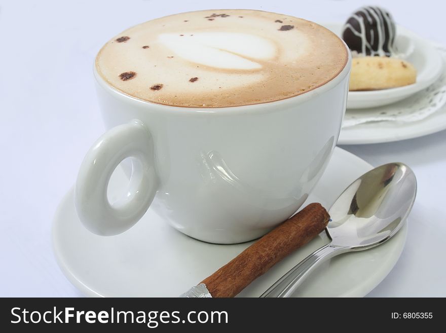Coffee cappuccino with foam and cinnamon stick. Coffee cappuccino with foam and cinnamon stick