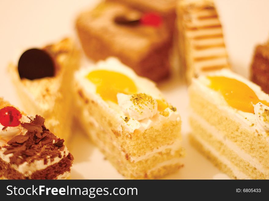 Many kind of sweets and desserts with unfocus background