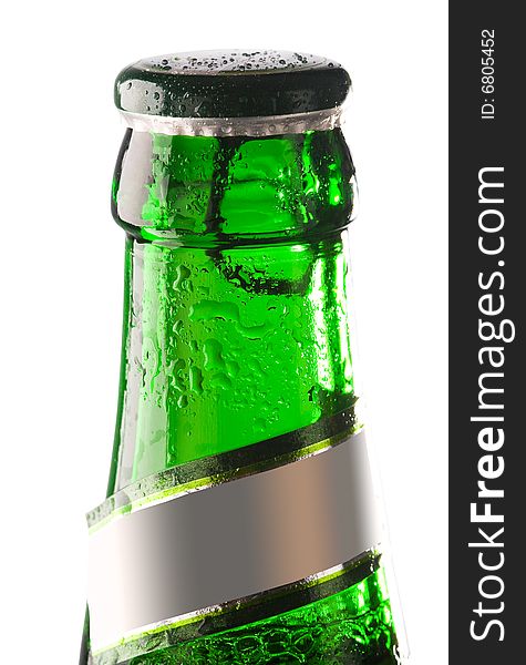 Green bottle of beer with water drops