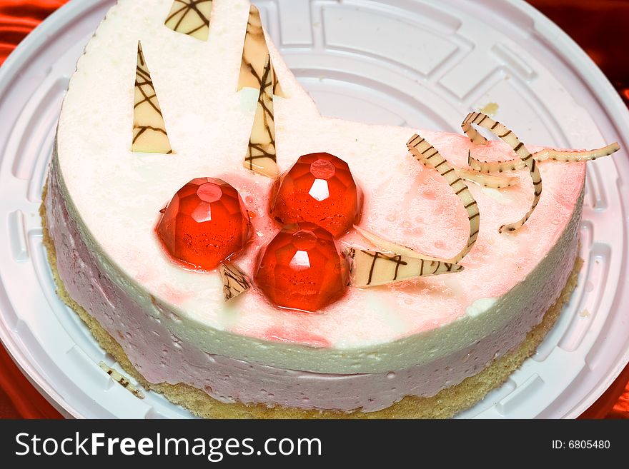 Piece of cake with red decoration