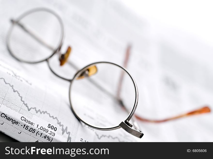 Glasses on a newspaper stock report. Glasses on a newspaper stock report