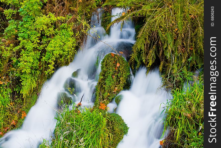 Waterfall in the mountains in autumn. Waterfall in the mountains in autumn