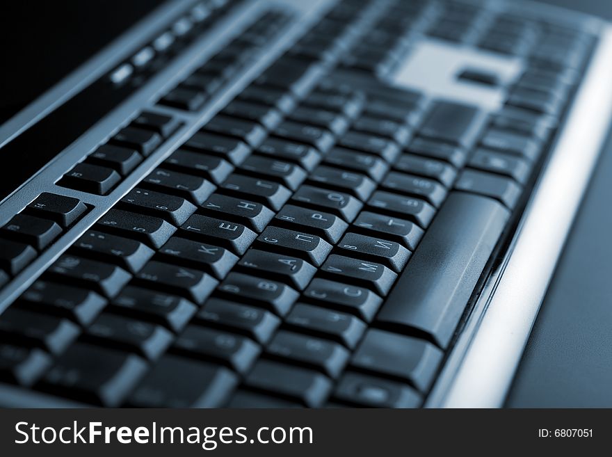 Abstract dark keyboard background (shallow focus)