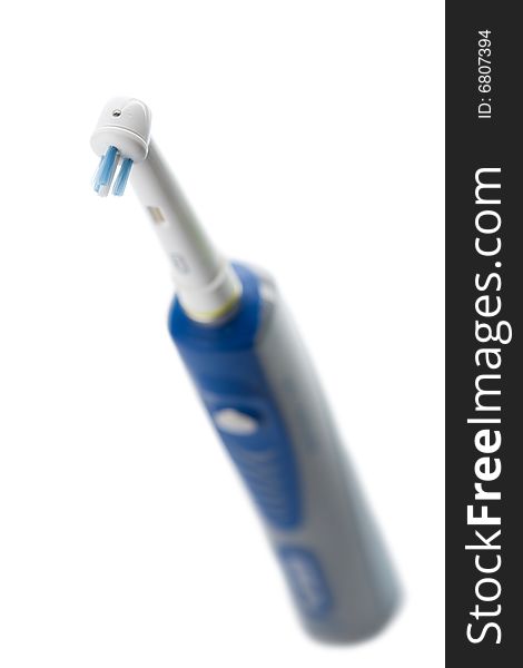 Electric toothbrush isolated over white