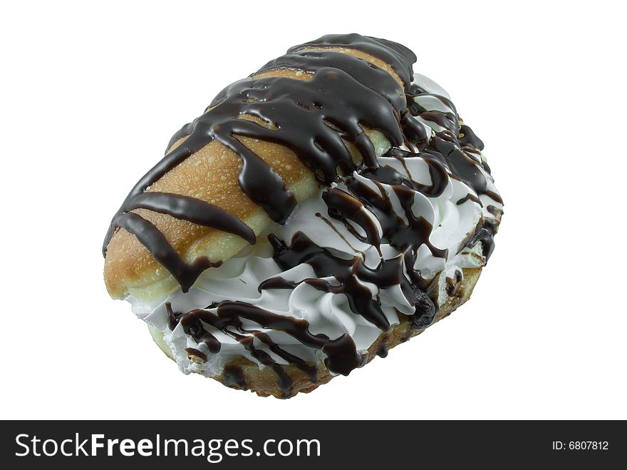 Cream filled puff drizzled with chocolate isolated on white