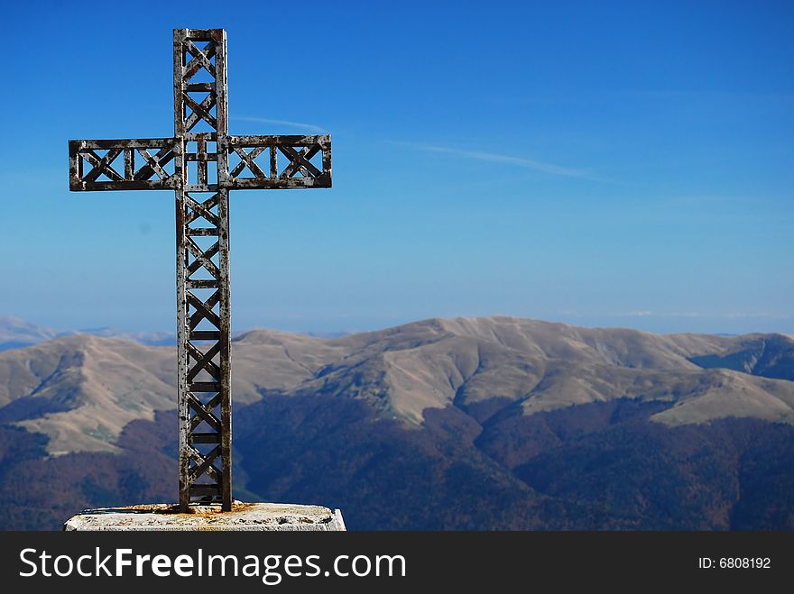 Cross on a mountain,over a blue sky