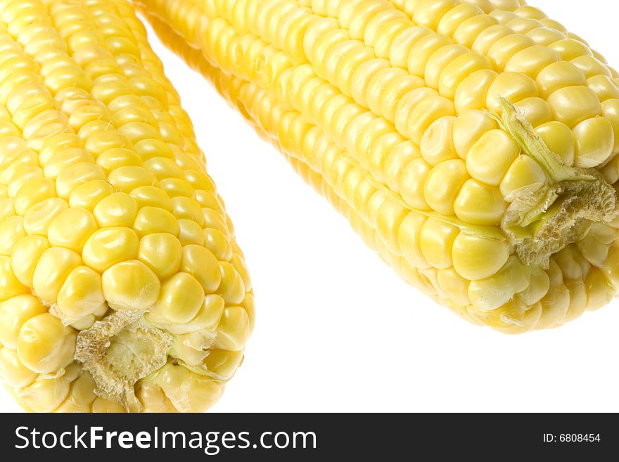 Uncooked corn on a white background. Uncooked corn on a white background.