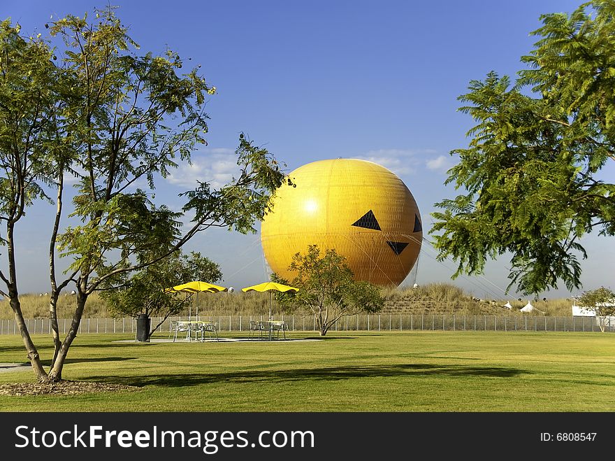 Orange Hot Air Balloon Resting on Ground