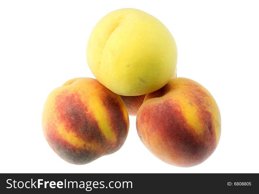 Pyramid of peaches on white. Pyramid of peaches on white.