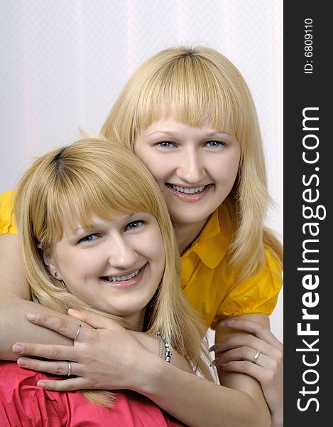 Portrait of two smiling blond sisters. Portrait of two smiling blond sisters