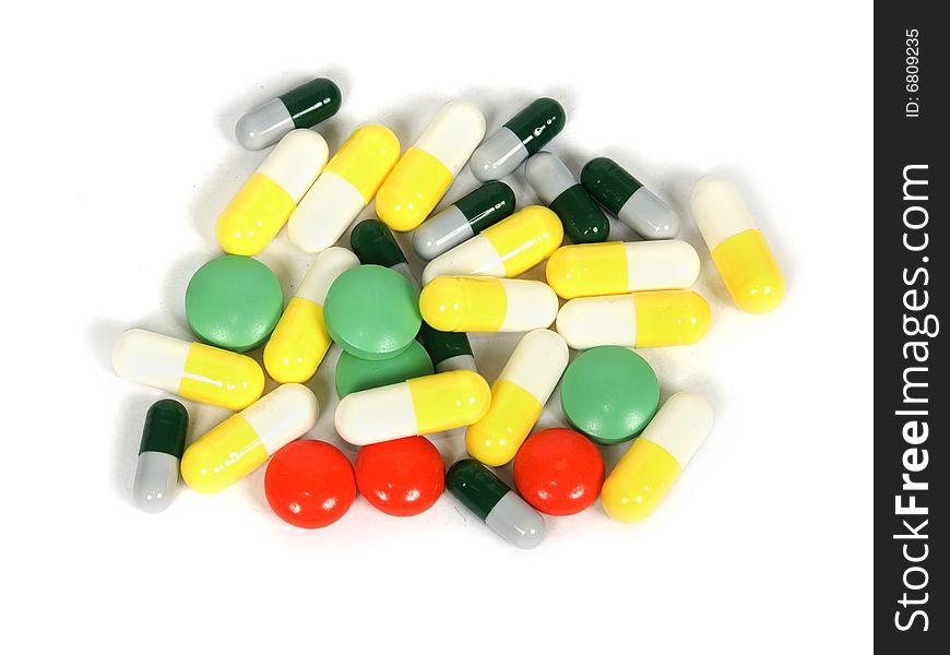 Tablets and capsules with a medicine on a white background