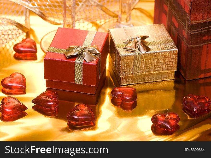 Red and gold gift box with hearts