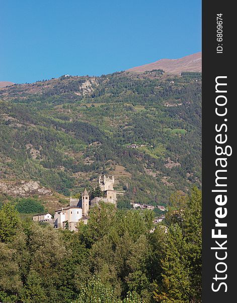 Medieval castle on hill in Italy, Aosta region, vertical. Medieval castle on hill in Italy, Aosta region, vertical