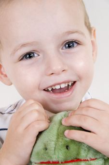 Cute Child Plying With Playing With A Stuffed Doll Stock Photography Cute Child Plying With Playing With A Stuffed Doll Stock Photography