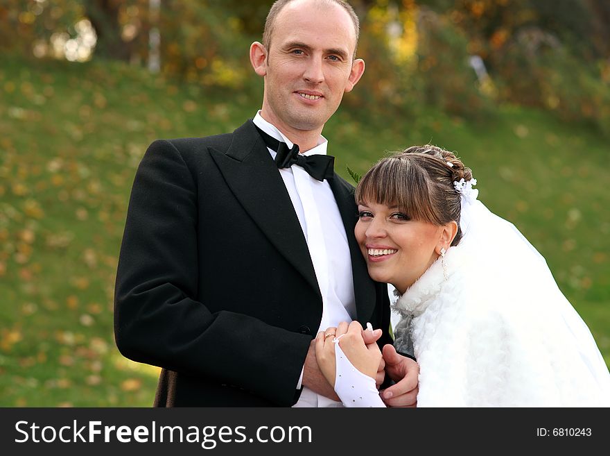 Smiling couple in wedding dress