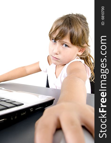 Little girl with laptop looking at the camera