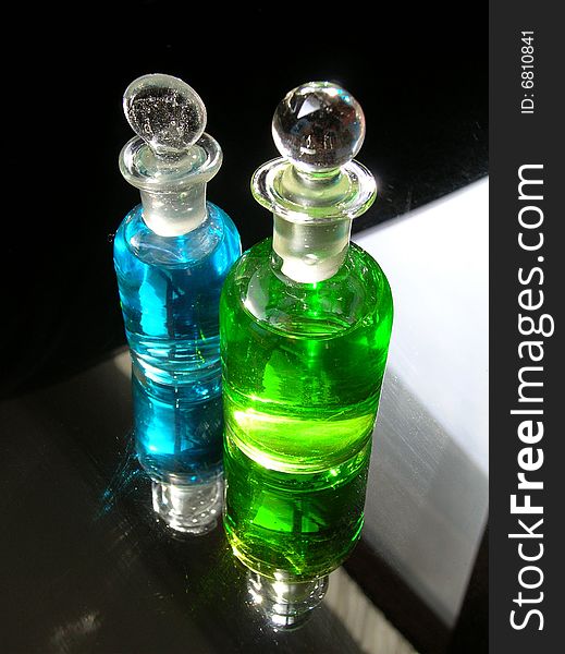 Two unusual bottles filled with mysterious liquids.