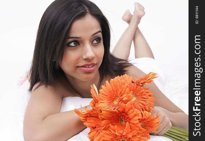 Asian woman with a bunch of gerbera