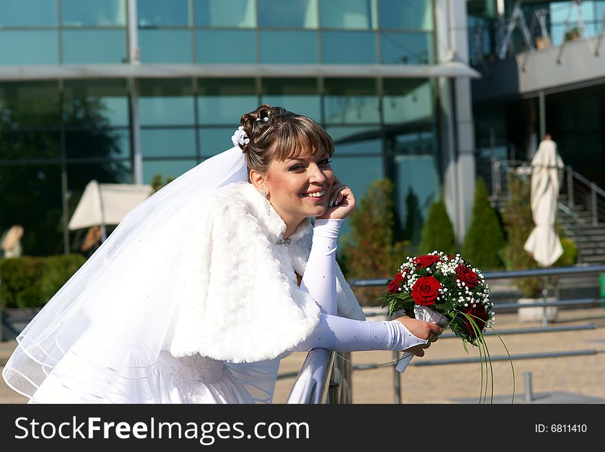 Smiling bride in wedding dress