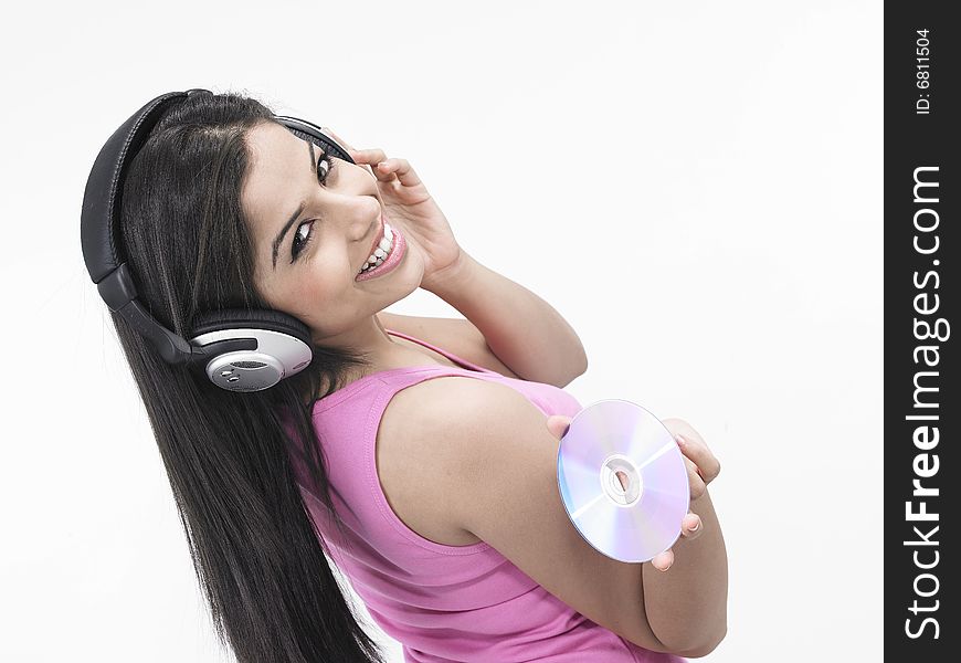 An asian girl of indian origin enjoying music. An asian girl of indian origin enjoying music