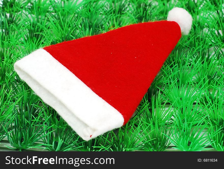 Santa hat image on the green grass background