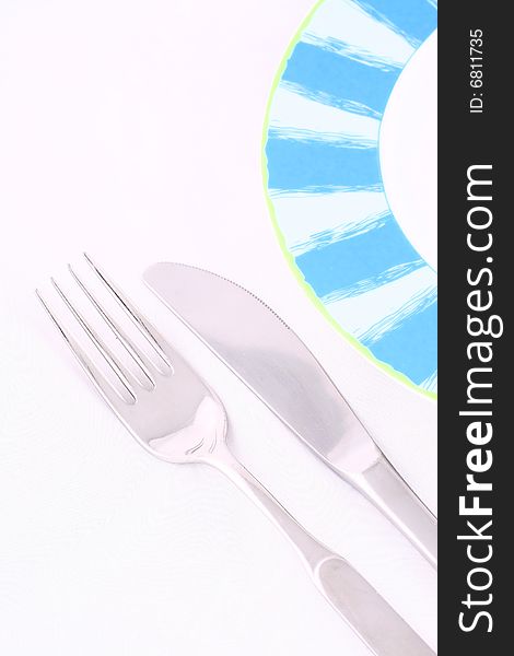 Silver tableware over white background, isolated, plate