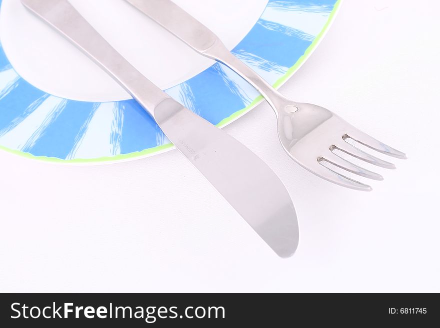Silver tableware over white background, isolated, plate