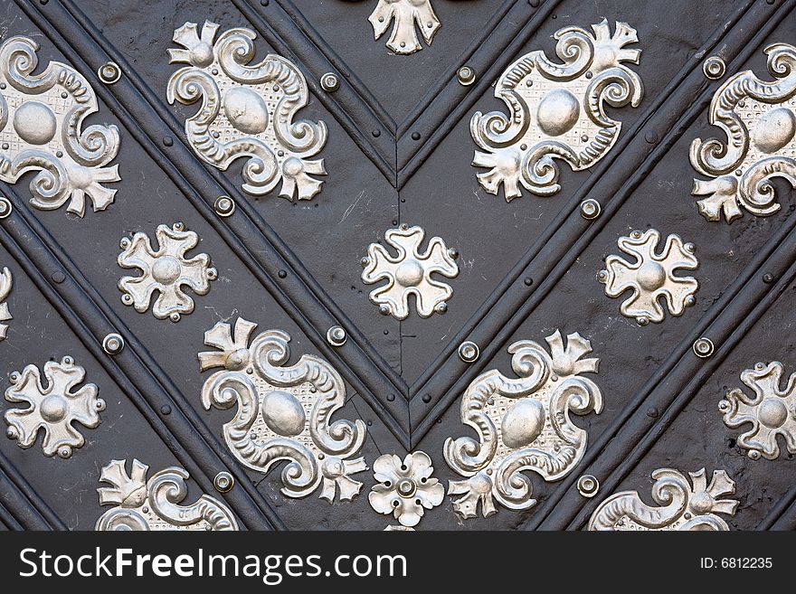 Decoration detail of old metal iron entrance door in Prague Little quarter. Decoration detail of old metal iron entrance door in Prague Little quarter.