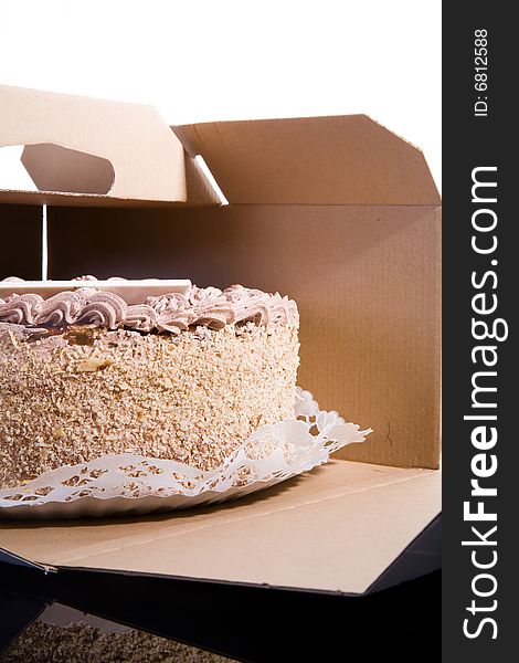 Caramel cake in an opened cake box