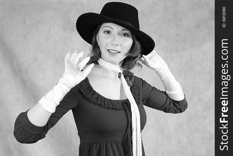 A Woman In Hat And Gloves