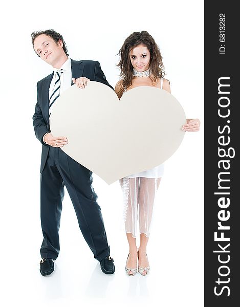 Young couple holding heart shape, isolated on white background