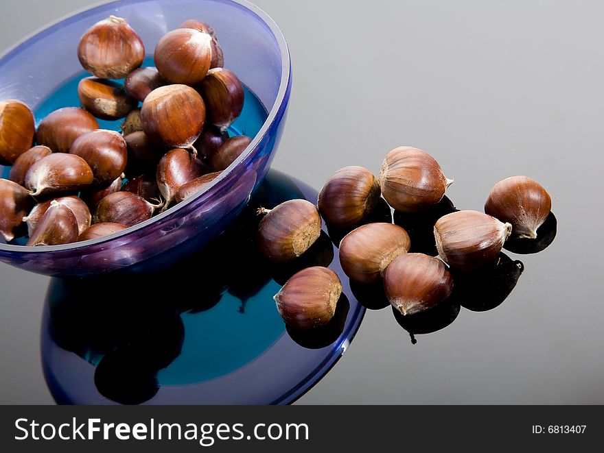 Chestnuts and blue plastic plate