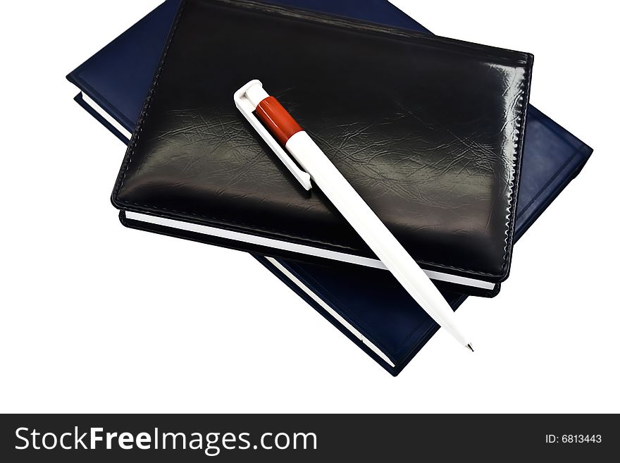 Notebook and the pencil isolated on a white background